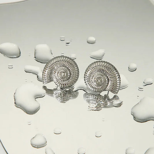 Boucles d'oreilles en acier avec coquillages - w040