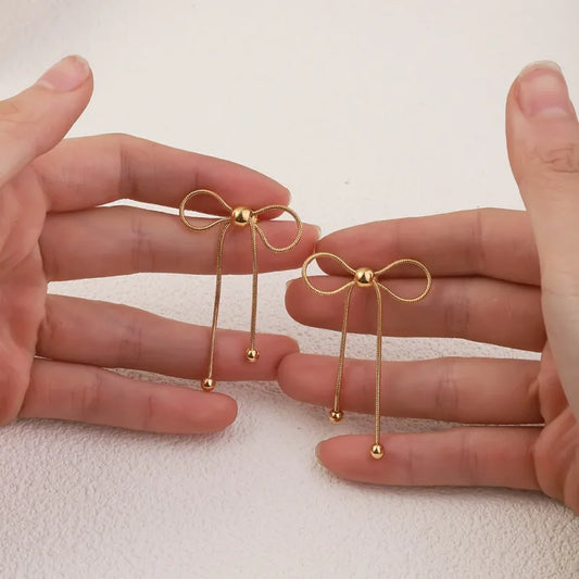 Σκουλαρίκια επιχρυσωμένο ατσάλι φιογκάκια -EA680