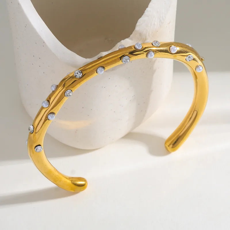 Βραχιόλι επιχρυσωμένο ατσάλι με πέρλες και zircon - BR503