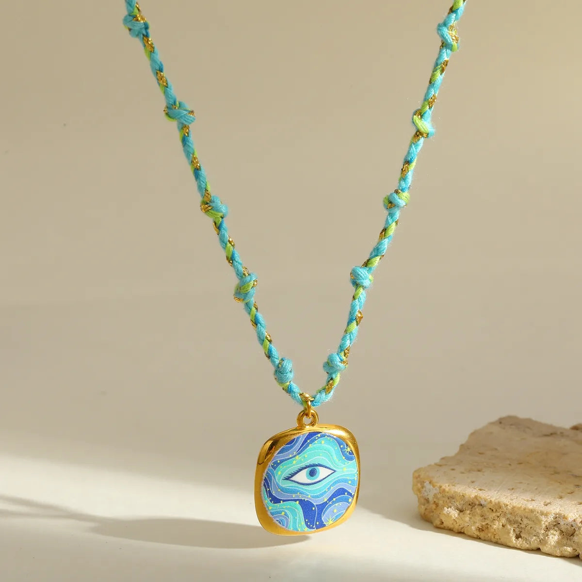 Κολιέ επιχρυσωμένο ατσάλι και σχοινί με μάτι - NE710