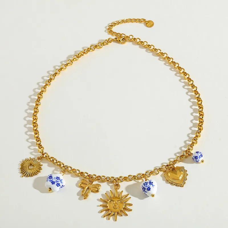 Κολιέ ατσάλινο με ήλιο και charms- NE433