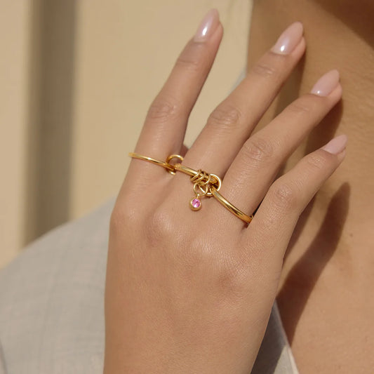 Anillo triple de acero y oro con circonita rosa - R215