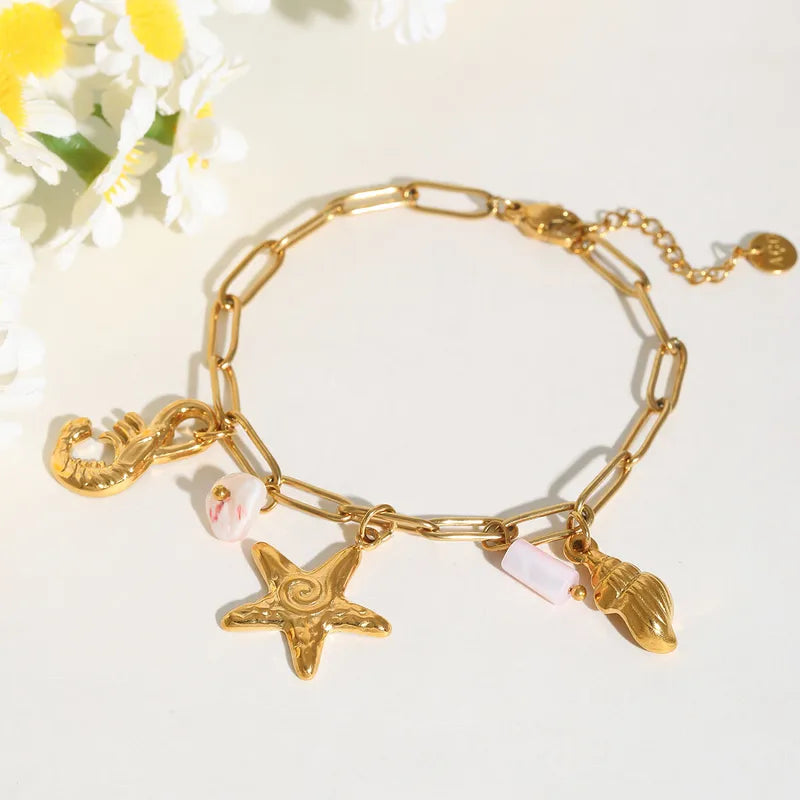 Bratara din otel placat cu aur cu stea de mare si scoici -