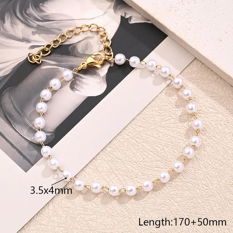 Bracciale in acciaio oro con perle rotonde-br091