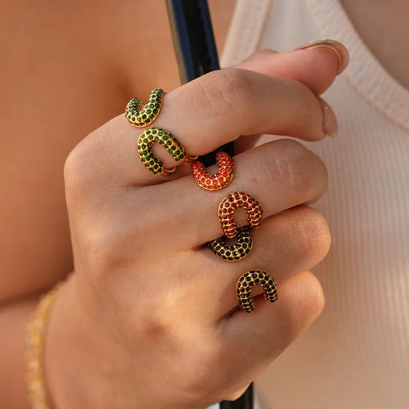 Bague acier doré avec zircons noirs - R382