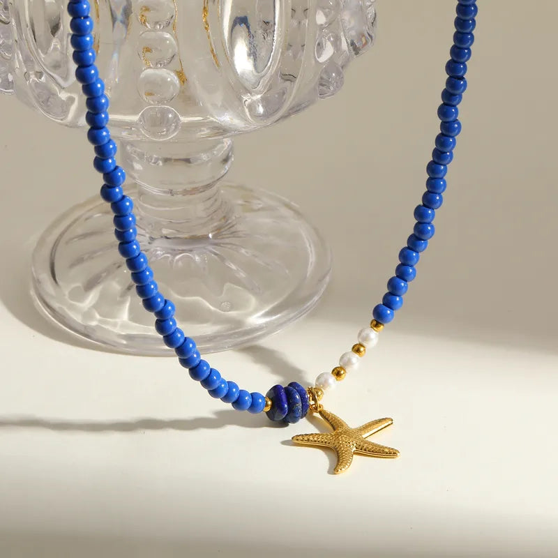 Κολιέ με μπλε χάντρες και ατσάλινο αστερία - NE449