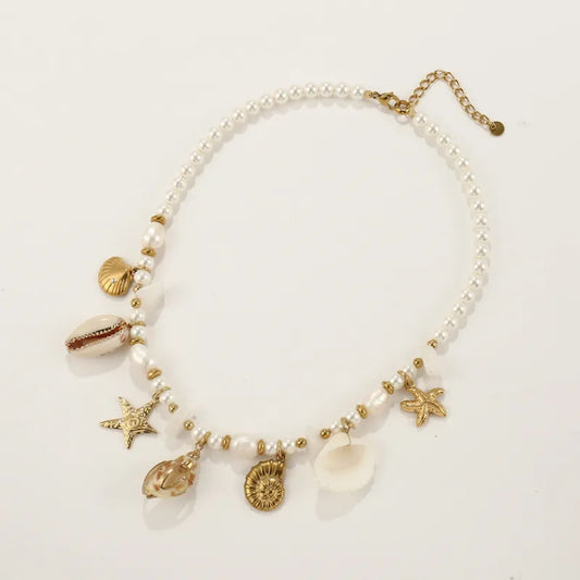 Necklace gold steel with pearls and shells-