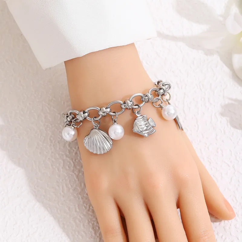 Steel bracelet with pearls and summer symbols