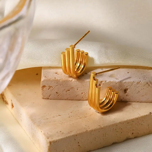 Orecchini in acciaio dorato triplo pista-EA169