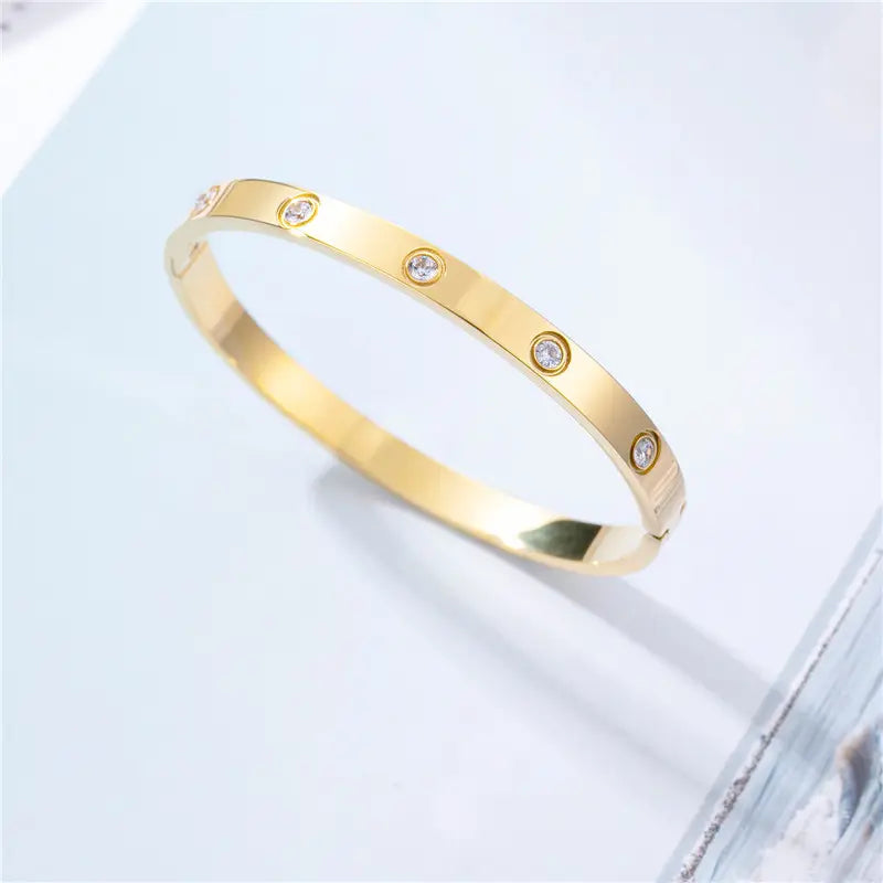 Gold steel handcuff bracelet with rhinestones - BR200