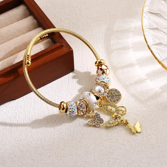 Βραχιόλι χρυσό ατσάλι με πεταλούδα και charms-BR289