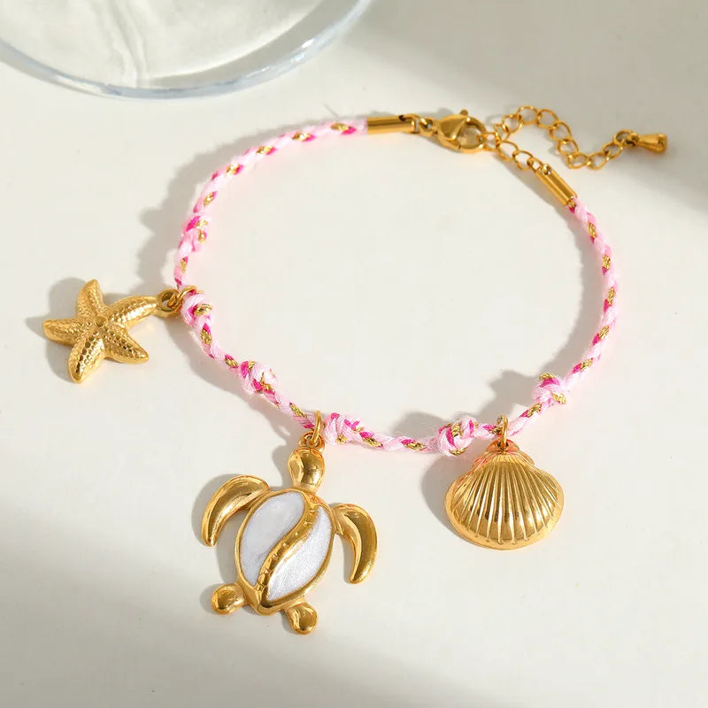 Βραχιόλι επιχρυσωμένο ατσάλι ροζ με θαλασσινά charms - BR445