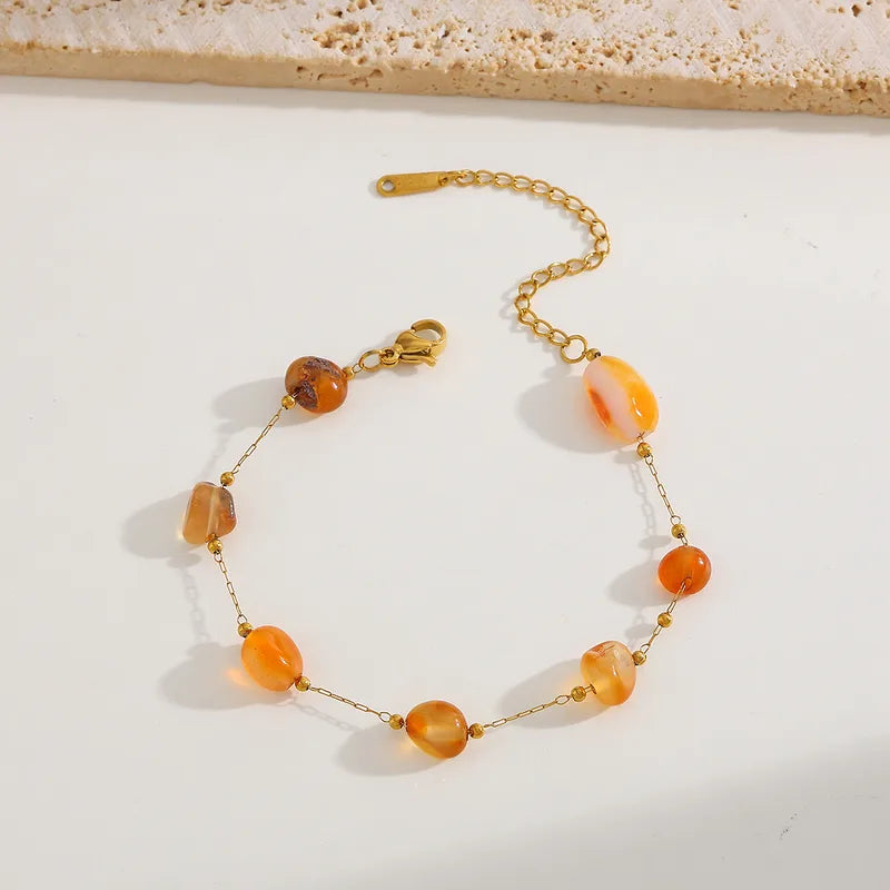 Βραχιόλι ατσάλινο με πορτοκαλί πέτρες - BR389