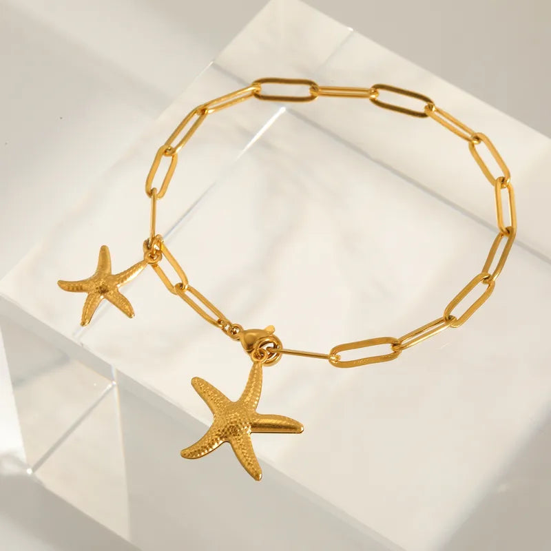 Βραχιόλι ατσάλινο χρυσό με αστερίες - BR382