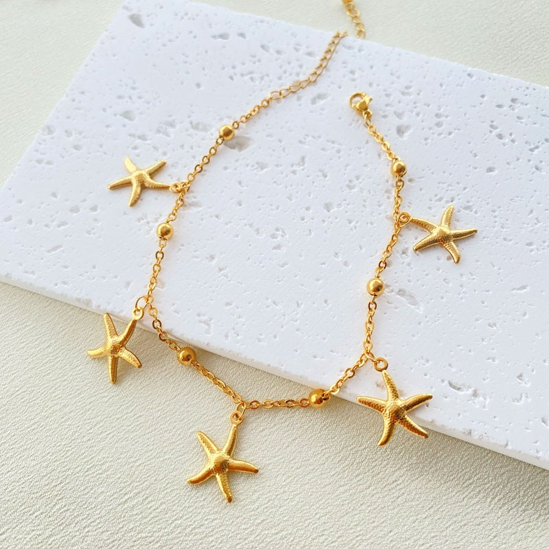 *Foot bracelet gilded steel with star-AN078