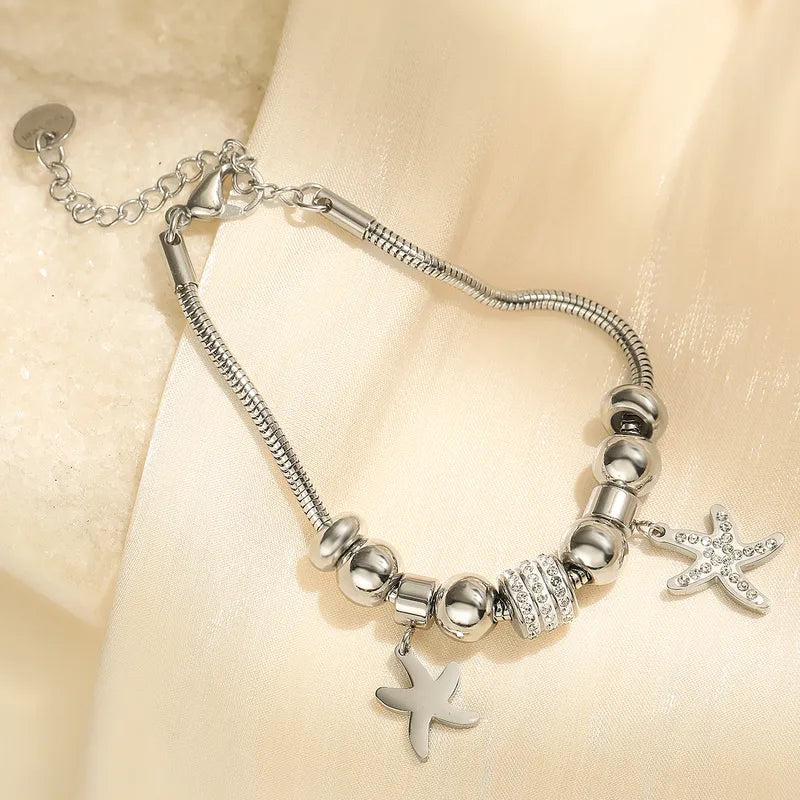 Βραχιόλι ατσάλι με αστερίες και στρας - BR455