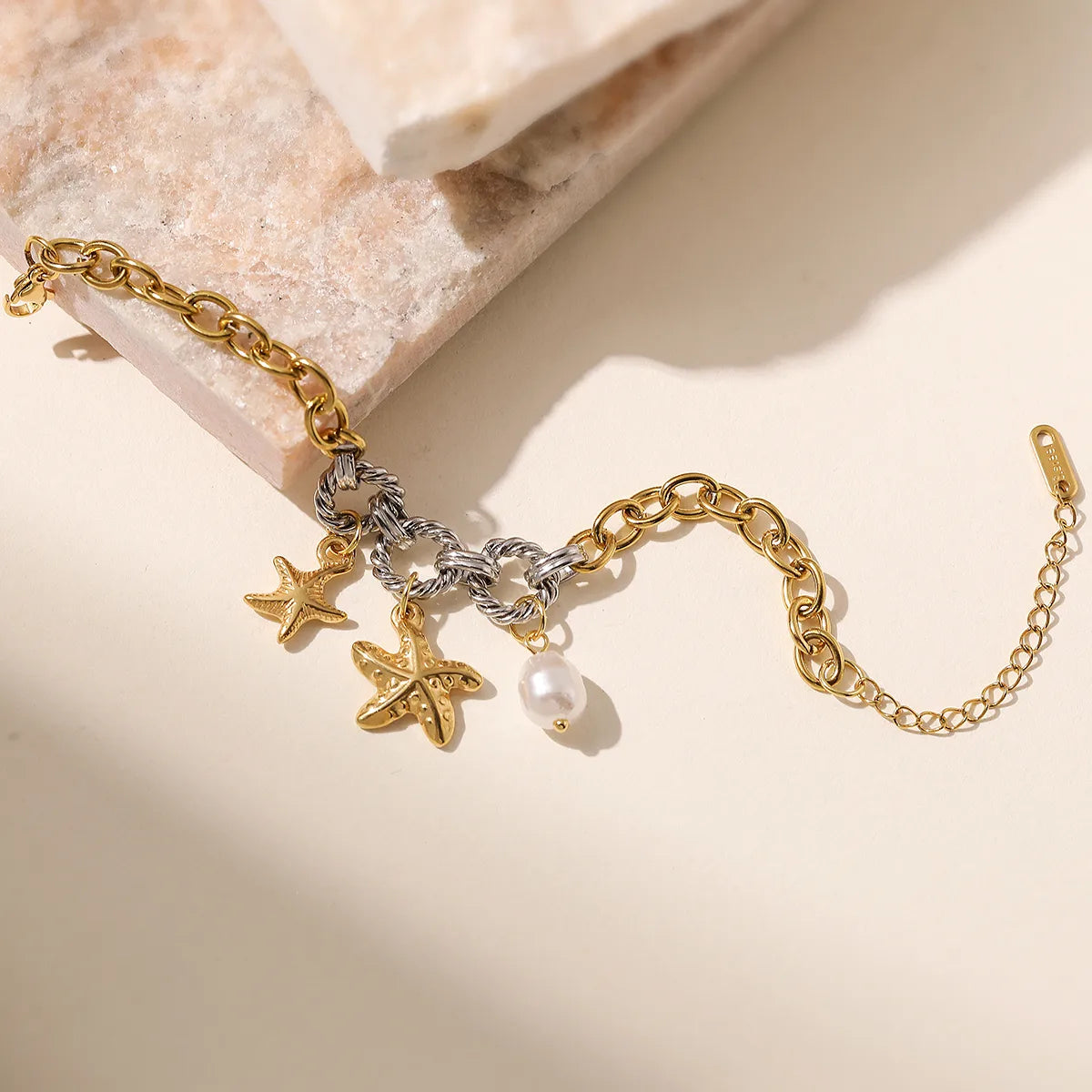Bracelet of steel silver and gold with starfish -