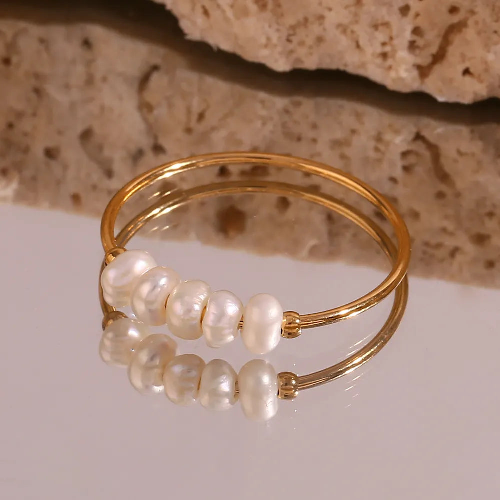Thin steel ring with pearls - R104