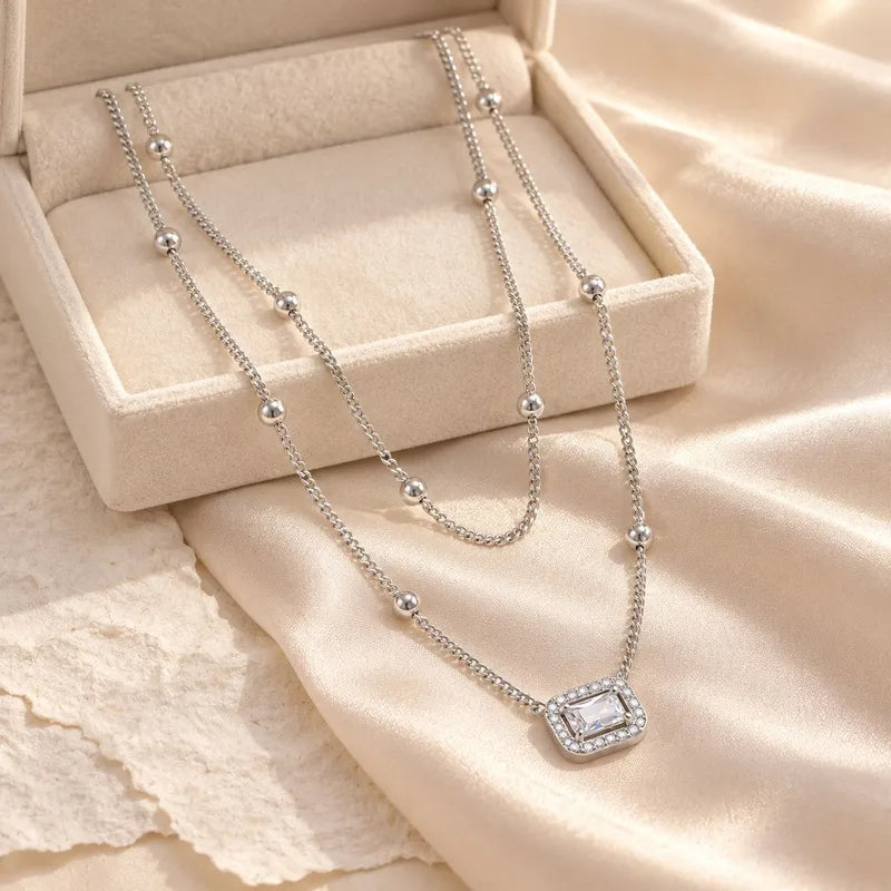 Halskette aus Stahlgold mit blauen Zirkonen – NE713
