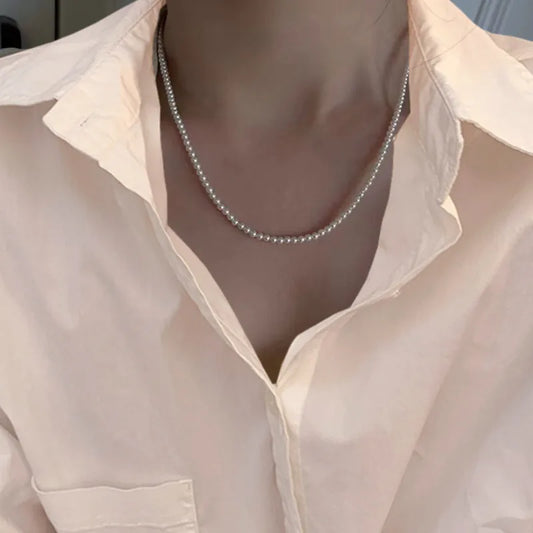 Steel necklace with pearls - NE101