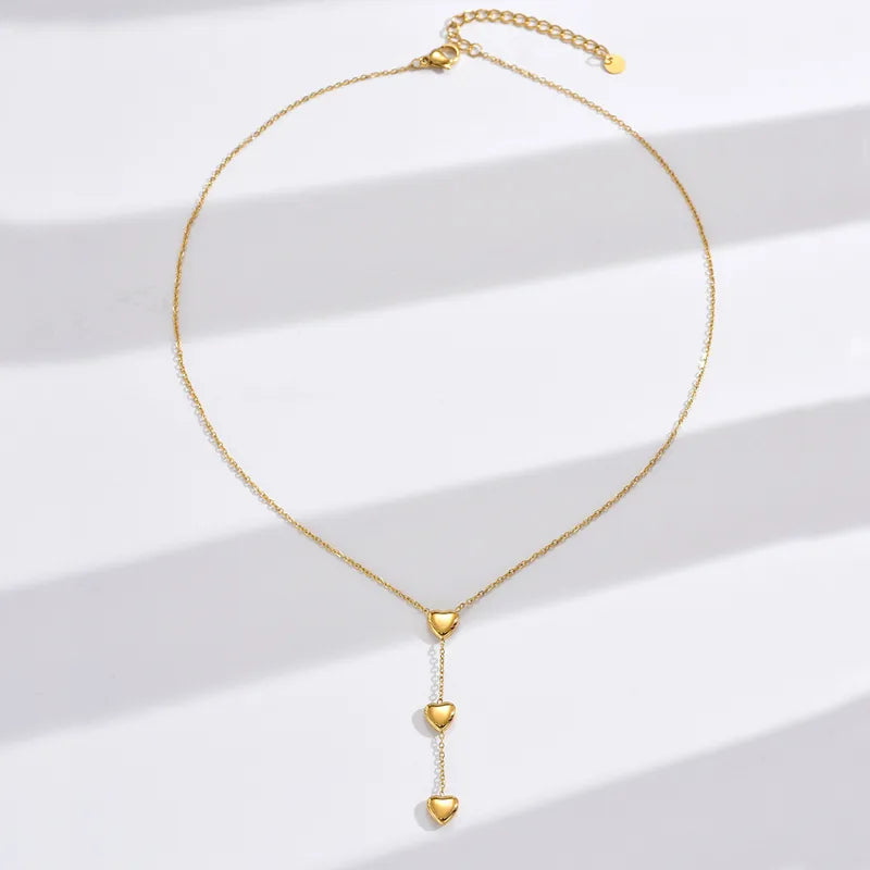 Κολιέ ατσάλινο χρυσό με καρδιές - w595