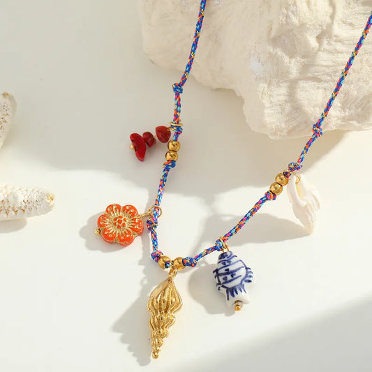 Necklace Gold Plot with fabric rope and marine charms-