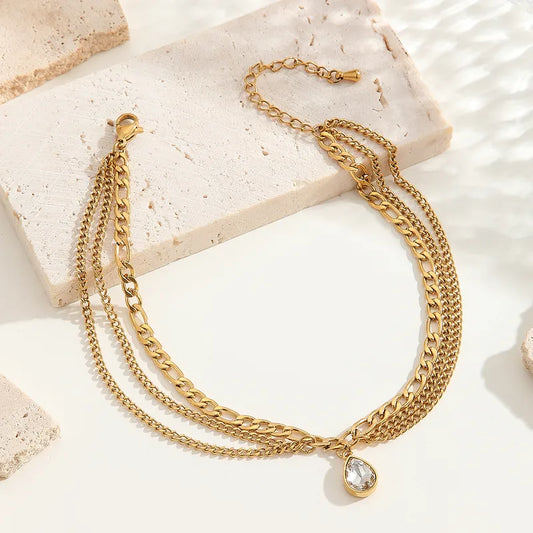 Βραχιόλι ποδιού χρυσό ατσάλι με τριπλή αλυσίδα και στρόγγυλο κρύσταλλο-AN075