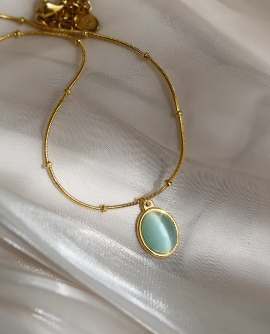 Colier din oțel auriu oval cu piatră albastră-NE061