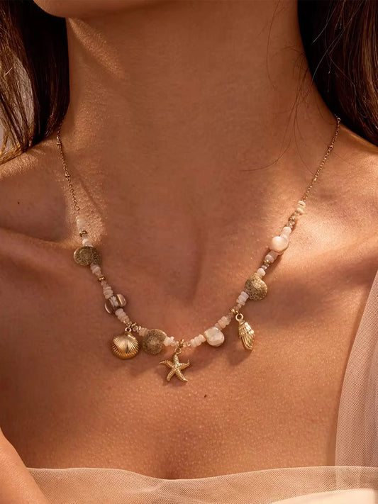 Necklace gilded steel with natural shells and stones-