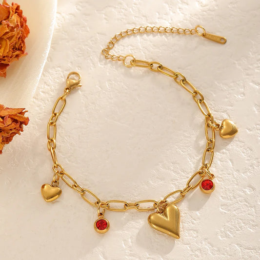 Βραχιόλι επιχρυσωμένο ατσάλι με καρδιές και κόκκινα zircon - BR274