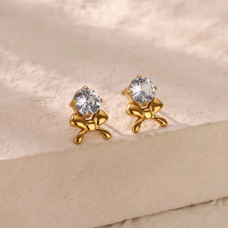 Earrings golden bow with zircon-ea397