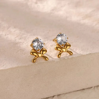 Earrings golden bow with zircon-ea397