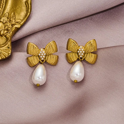 Earrings gilded steel with bow and pearl-ea497