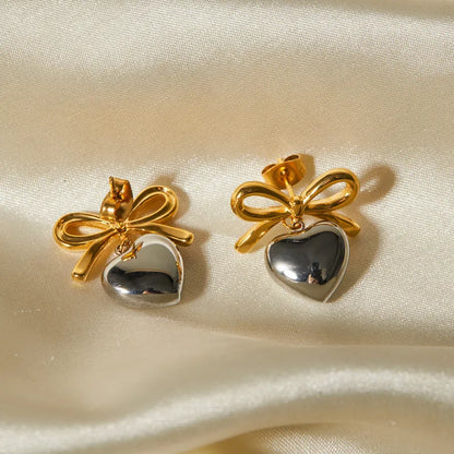 Σκουλαρίκια ατσάλι χρυσό και ασημί με καρδιά και φιόγκο-EA022