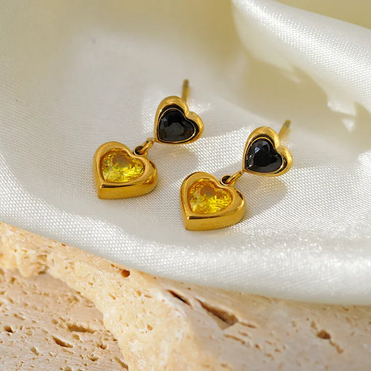 Steel earrings with two hanging hearts with black and yellow zircon - EA516