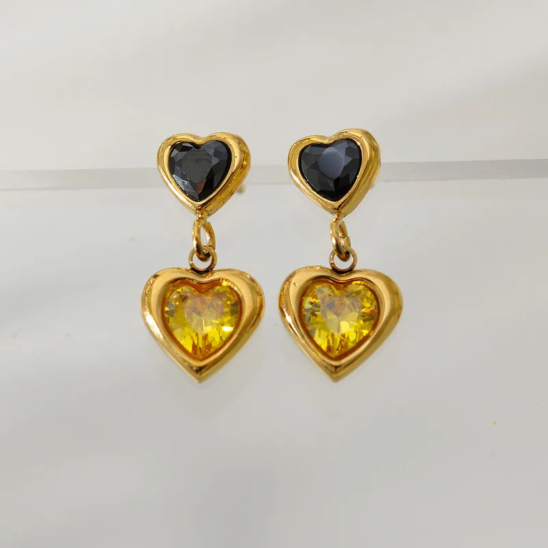 Steel earrings with two hanging hearts with black and yellow zircon - EA516