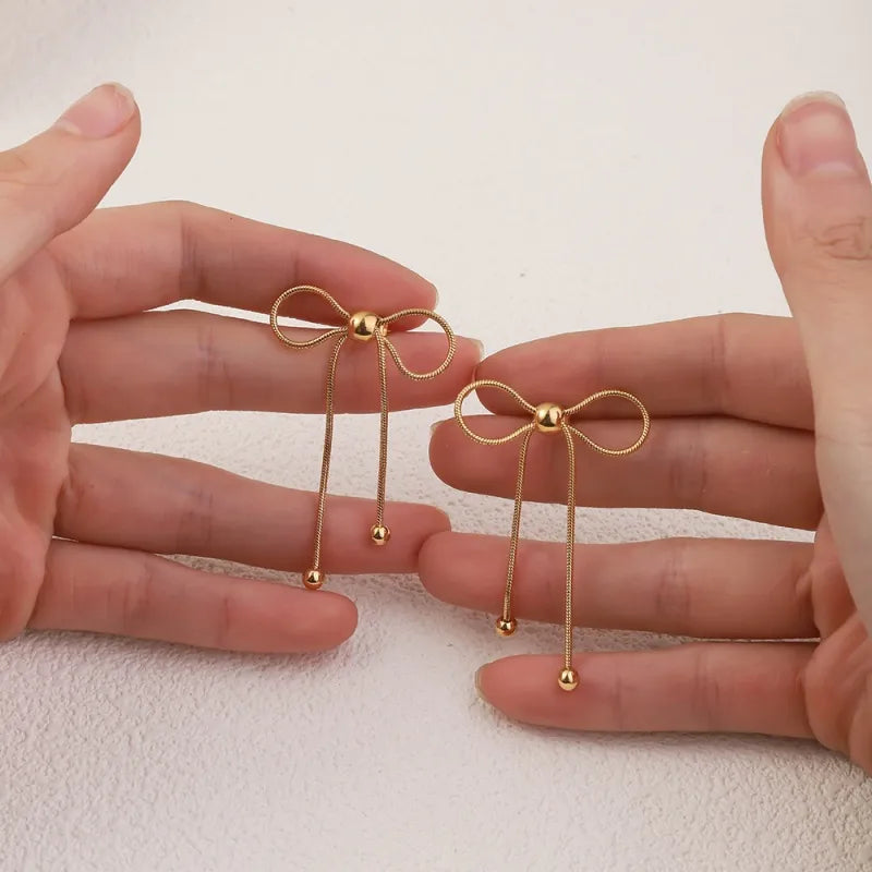 Σκουλαρίκια επιχρυσωμένο ατσάλι φιογκάκια -EA680