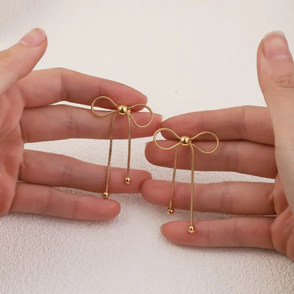 Σκουλαρίκια επιχρυσωμένο ατσάλι φιογκάκια -EA680