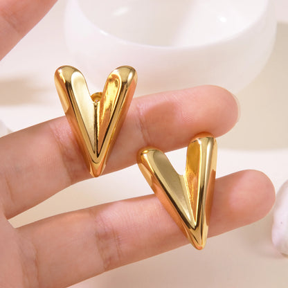 Steel earrings with golden hearts - w464