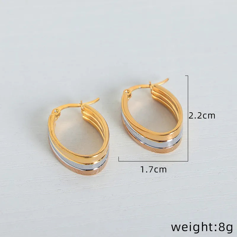 Titanium earrings oval gold with silver-ea600