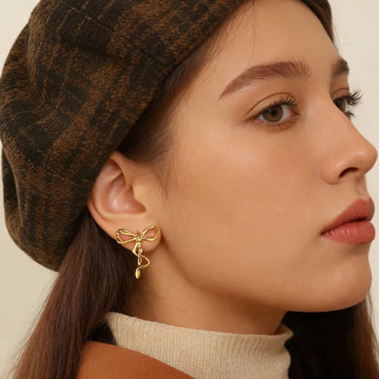 Σκουλαρίκια επιχρυσωμένο ατσάλι φιόγκος-EA673