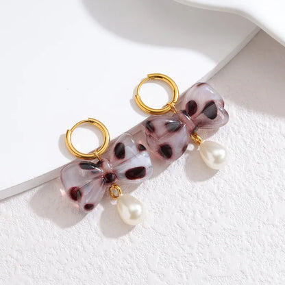 Σκουλαρίκια επιχρυσωμένο ατσάλι φιόγκος με πέρλα-EA393