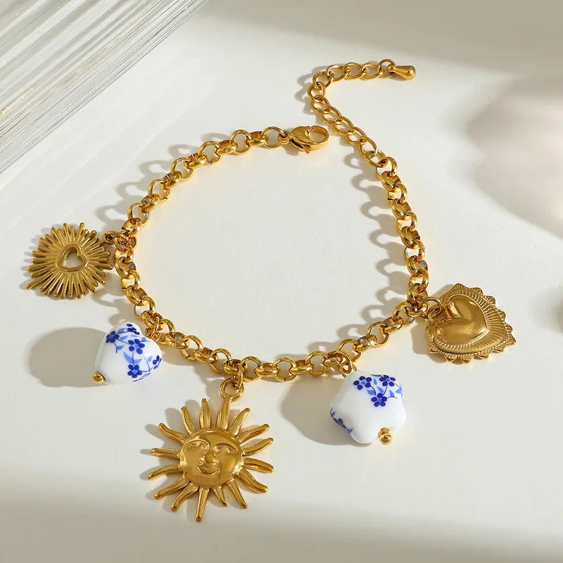 Βραχιόλι ατσάλινο με ήλιο και charms- BR400