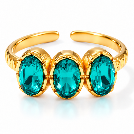 Bague en acier doré avec 3 zircons pétrole - R184