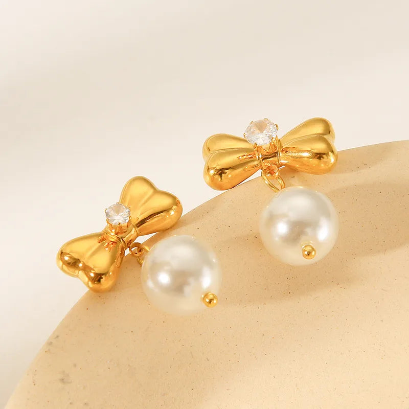 Σκουλαρίκια ατσάλινα με φιογκάκια- w583