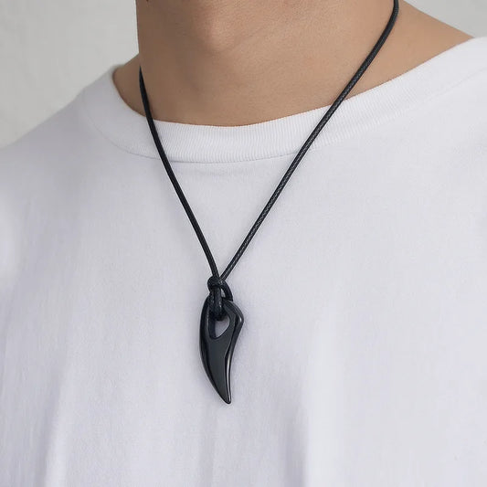 Necklace with a leather cord and steel black pendant tooth - ne349