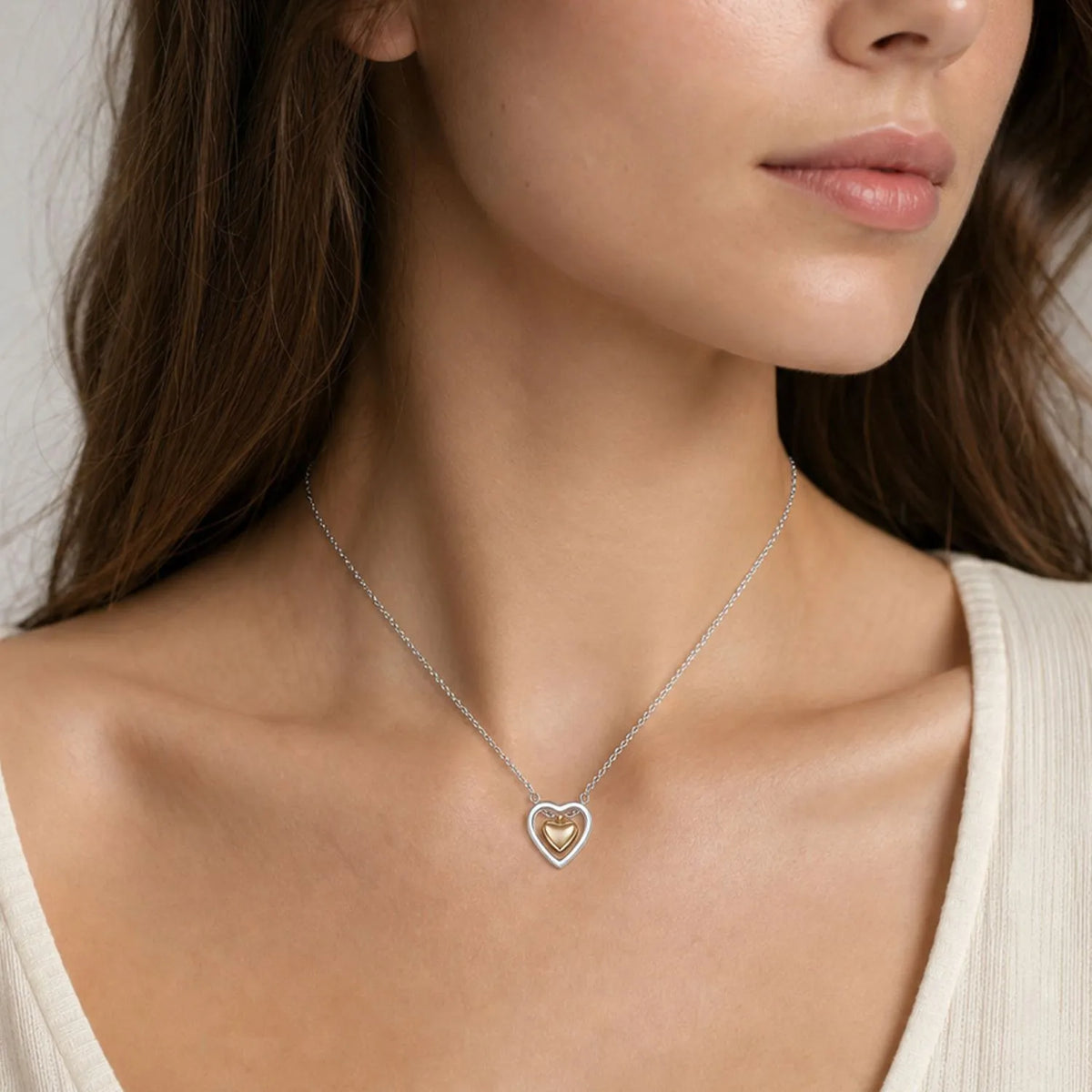 Collana in acciaio con cuore in oro e argento - NE545