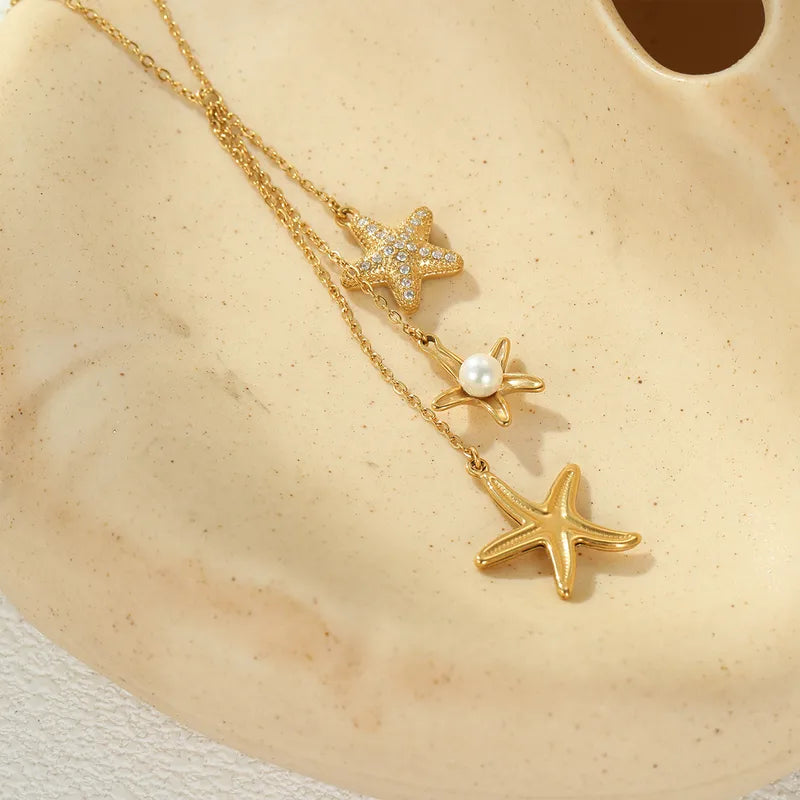 Steel necklace with pink zircon hearts - NE426