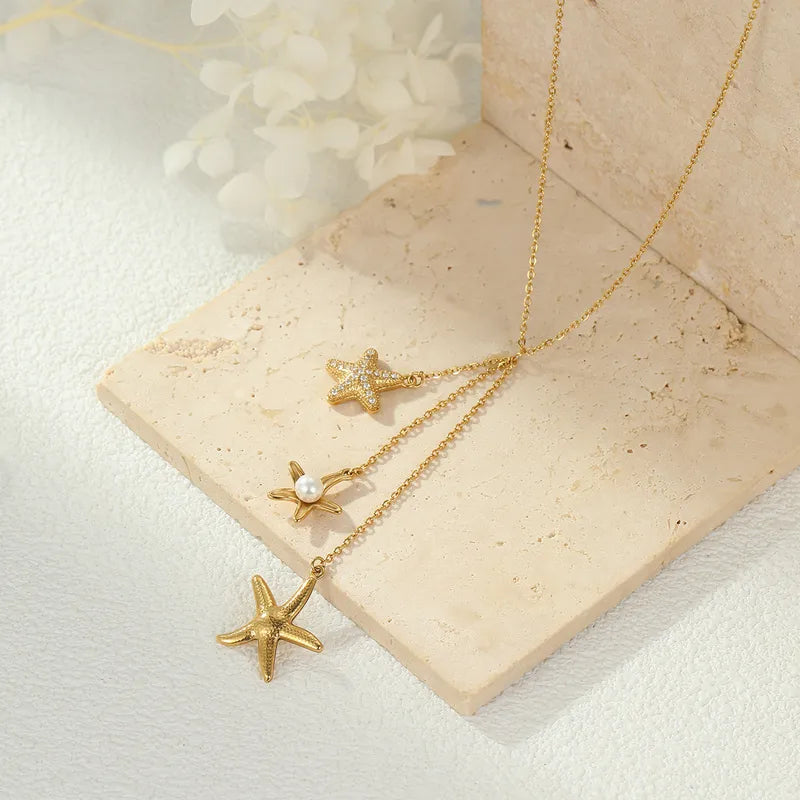 Steel necklace with pink zircon hearts - NE426