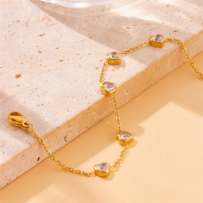 Pulseira em aço dourado com corações de cristal-BR169